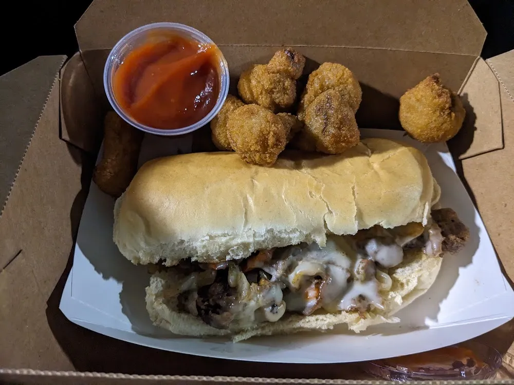 Philly Cheese Steak Sandwich and Fried Mushrooms