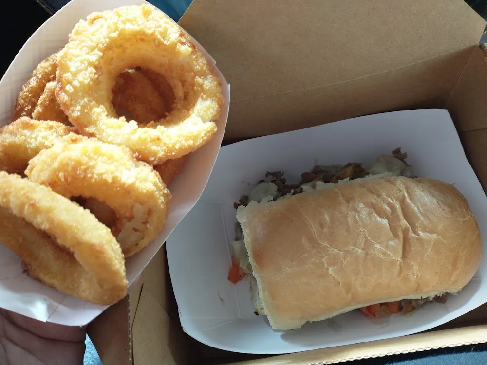 Philly Cheese Steak Sandwich and Onion Rings